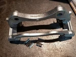 Genuine Ford New Caliper Support CK4Z-2B292-R BRBCF-52. Fixed Price $40.00.